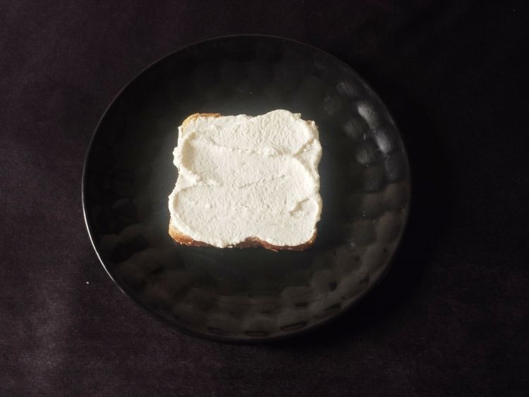 Step 2.1: Take one bread slice and spread the cream cheese on it