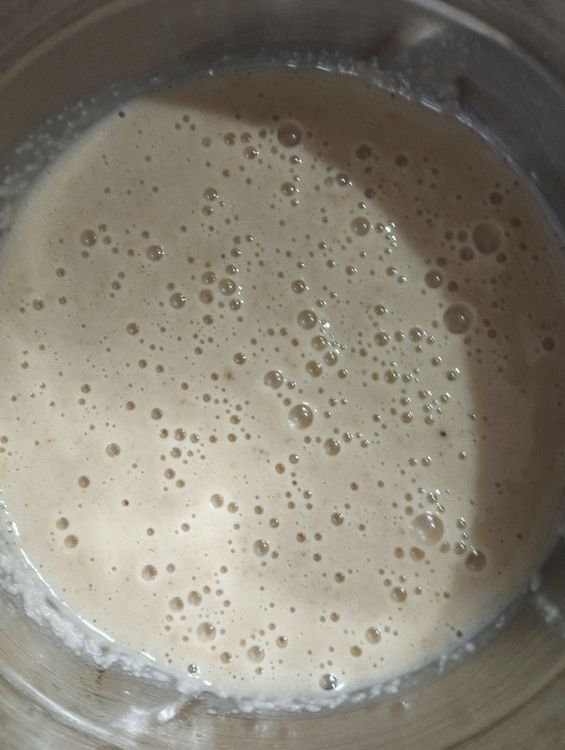 Step 1.2: In a blender, add the semolina-milk mixture, cooled jaggery syrup, ripe banana pieces, cardamom, and salt