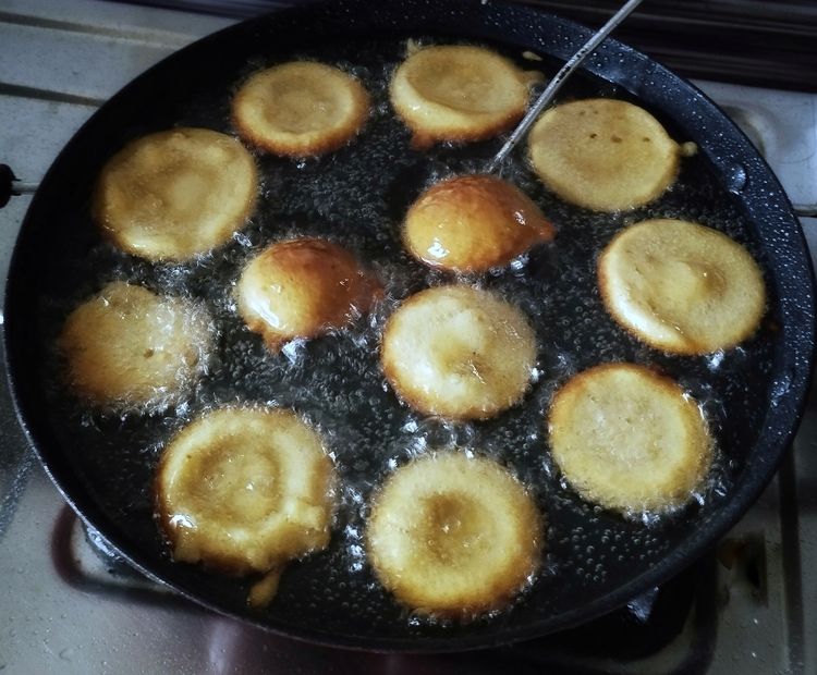 Step 1.1: When one side of the Unniyappam turns golden brown, flip it with a stick