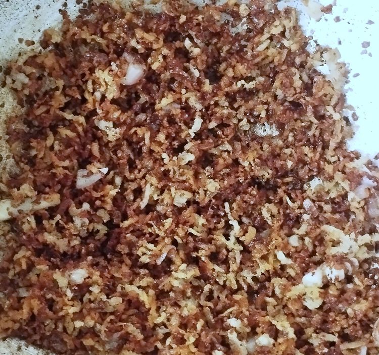 Step 1.1: Add coconut oil and again roast until the mixture turns dark golden brown over medium-low heat