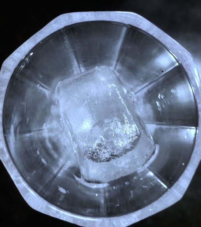 Step 1.1: Fill the glass with ice cubes and pour the chilled coconut water
