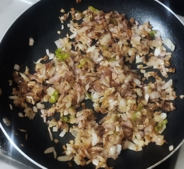 Step 1.1: Add chopped onion and sauté until it turns light brown