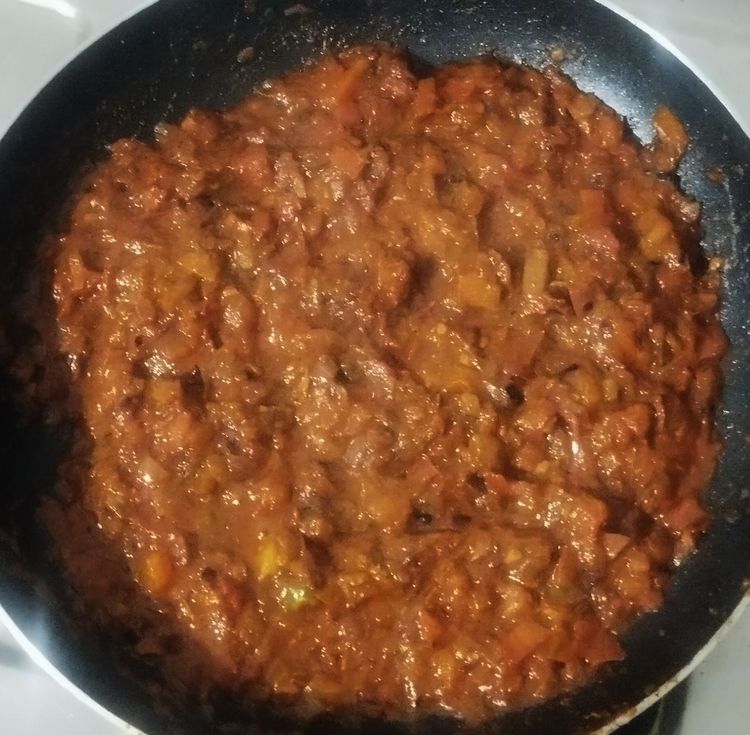 Step 1.2: Add 40 mL of water and sauté until the tomatoes are cooked well and become mushy
