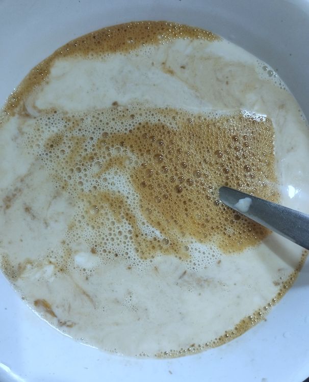 Step 2.1: Add room-temperature milk and sugar to the mixture, stirring until the sugar dissolves completely