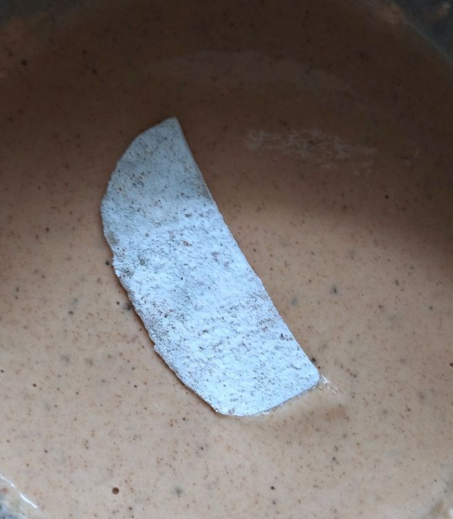 Step 1.1: Dip the dusted potato pieces in the batter and coat them evenly on all sides