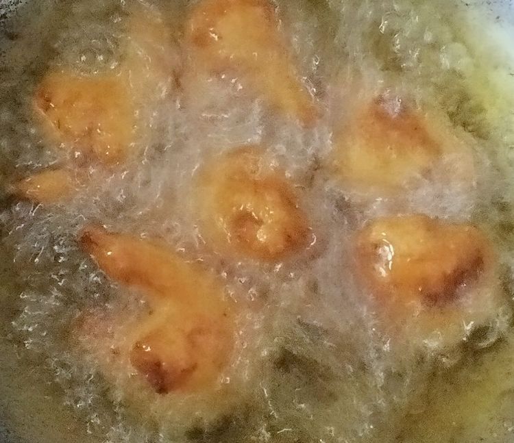 Step 1.2: Dip the cauliflower florets into the batter and deep fry them until golden brown