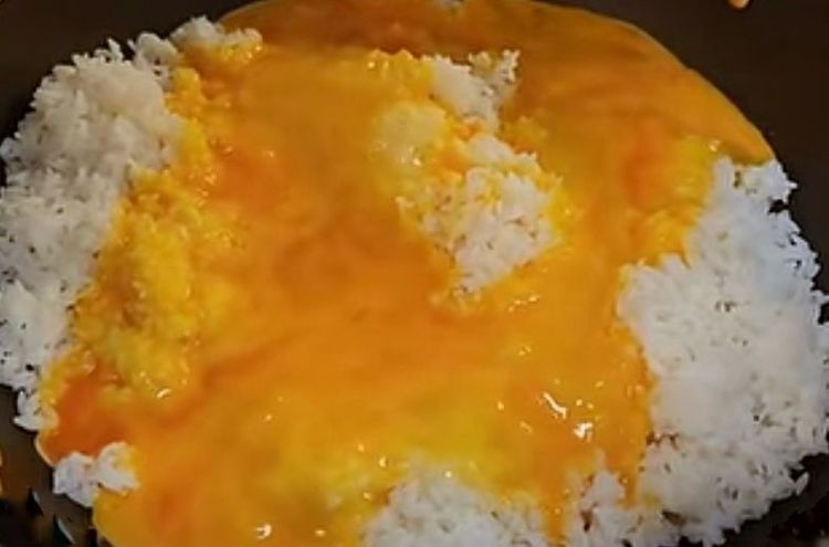 Step 1.1: At the time of cooking, take the rice out from the refrigerator and add beaten eggs to it