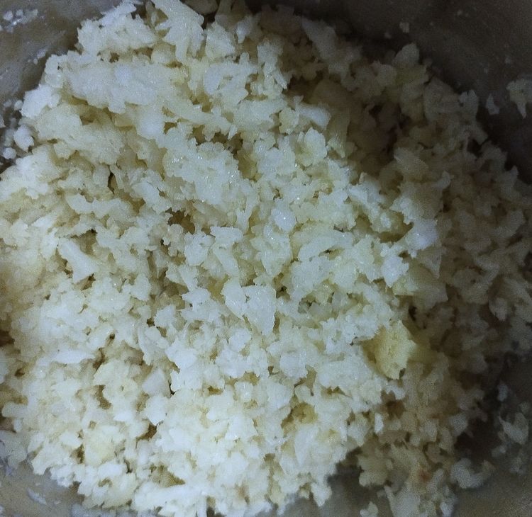 Step 2.1: Transfer the cooled cauliflower florets to a chopper and chop them finely