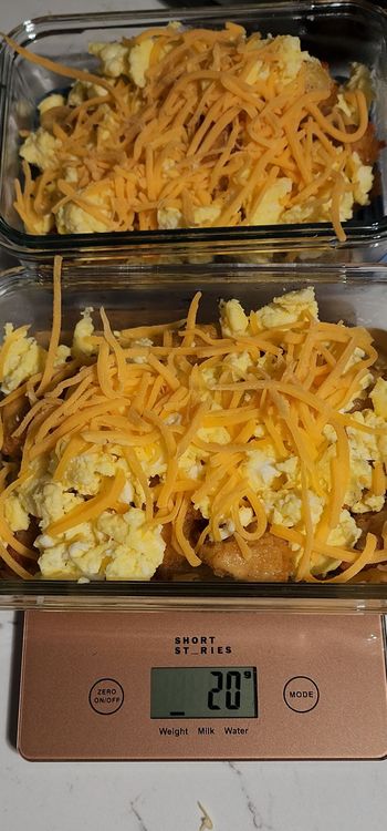 Step 1.1: Assemble the bowl by layering the nuggets, tater tots, scrambled eggs, and topping with sharp cheddar cheese