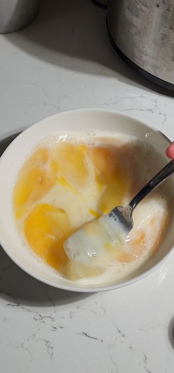 Step 1.1: In a bowl, whisk together eggs, milk, salt, and pepper until well combined