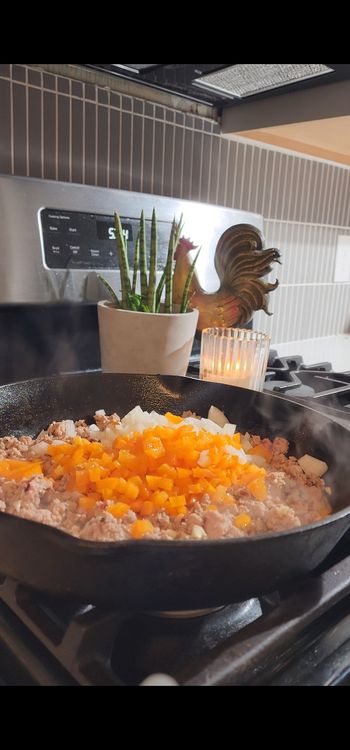 Step 1.2: Add spices (except italian seasoning), garlic, soy sauce, diced bell pepper, and onion to the skillet