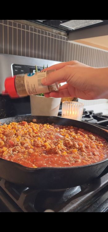 Step 1.2: Add protein pasta and Italian seasoning to the skillet