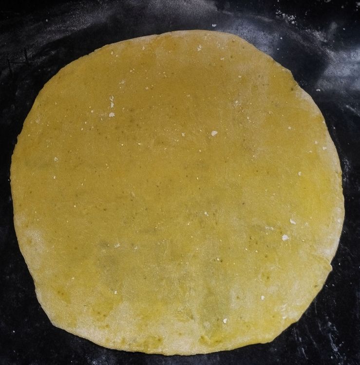 Step 2.1: Dust some flour on the countertop and roll each dough ball as thin as possible, dusting flour as needed