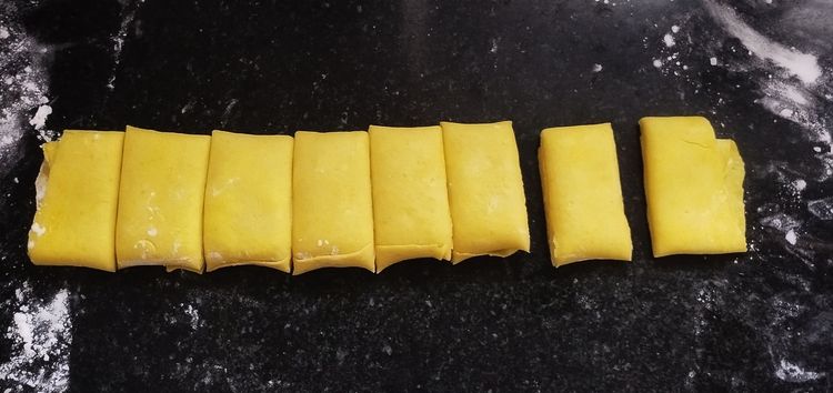 Step 2.1: Cut the rolled dough into 1-inch pieces and gently flatten each piece