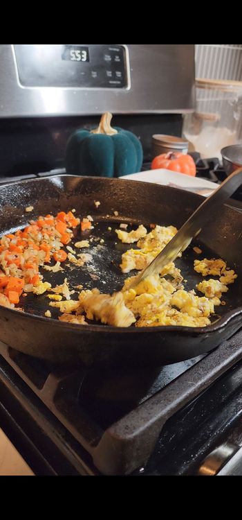 Step 1.1: Add eggs to the pan and scramble them