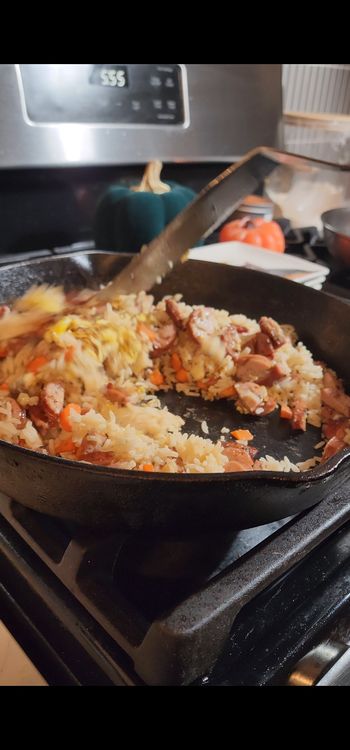 Step 1.2: Add the browned chicken sausage and cooked rice to the pan