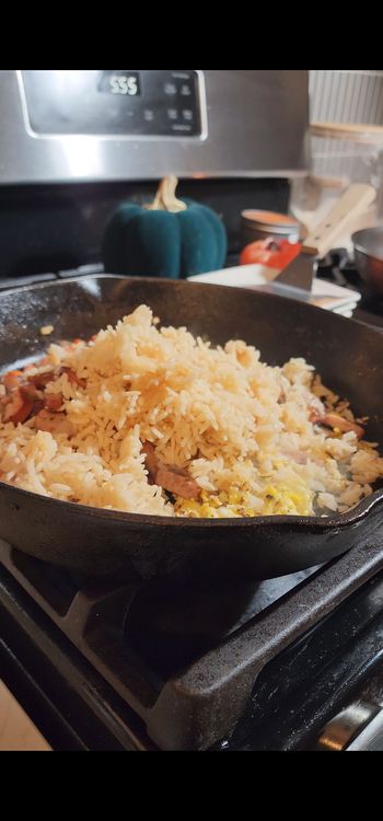 Step 1.1: Add the browned chicken sausage and cooked rice to the pan