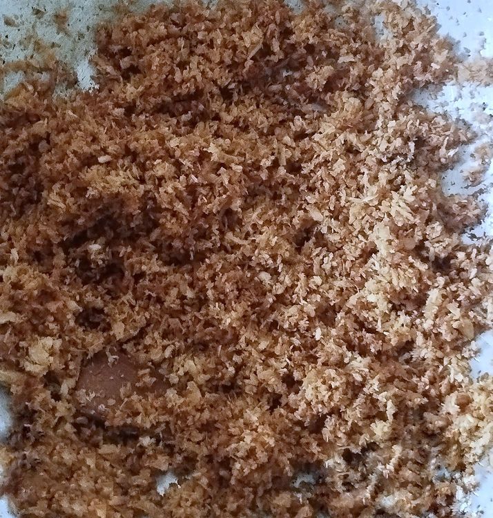 Step 1.1: Add the grated coconut and sauté until it turns golden brown on medium flame