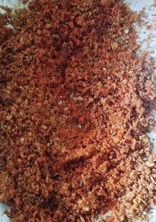 Step 1.1: Turn the flame to low and add chili powder, turmeric powder, and coriander powder
