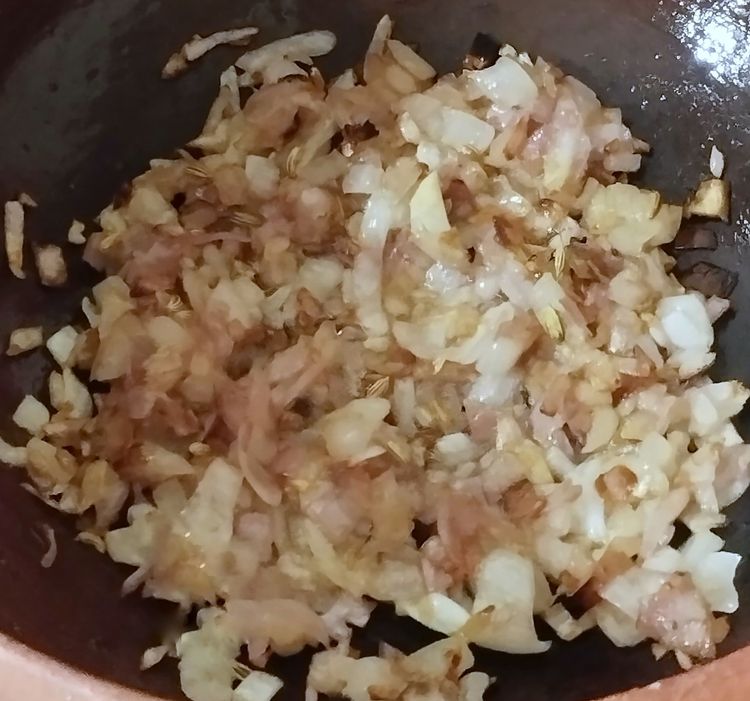 Step 2.2: Add chopped onions and sauté until they turn light brown