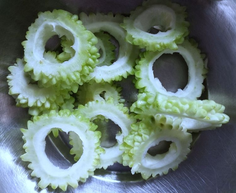 Step 1.1: Cut the bitter gourd into 1/4-inch round pieces