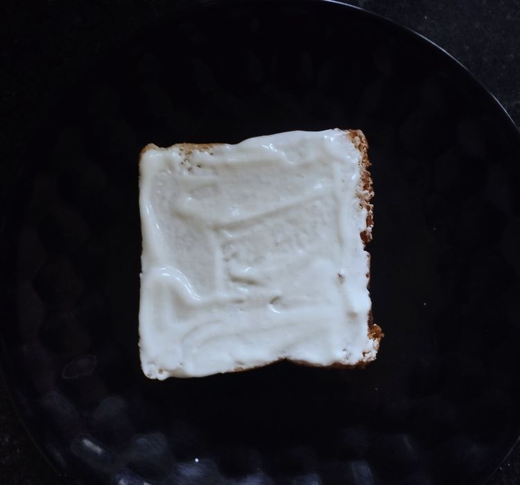 Step 1.1: Take one bread slice and spread cream cheese over it