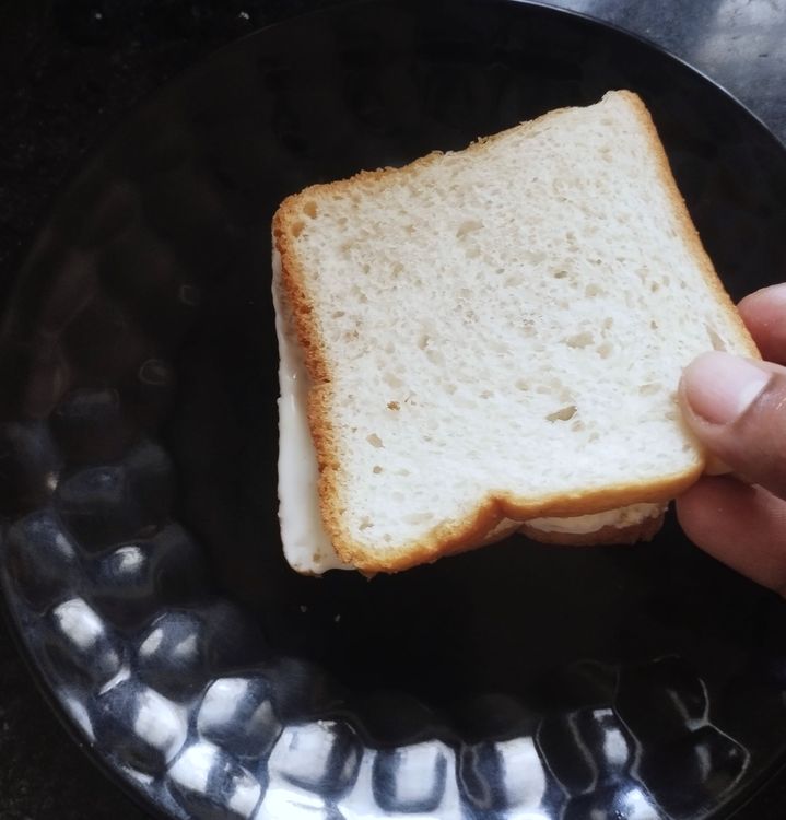 Step 1.1: Place another bread slice on top and spread the butter-sugar mixture on both sides