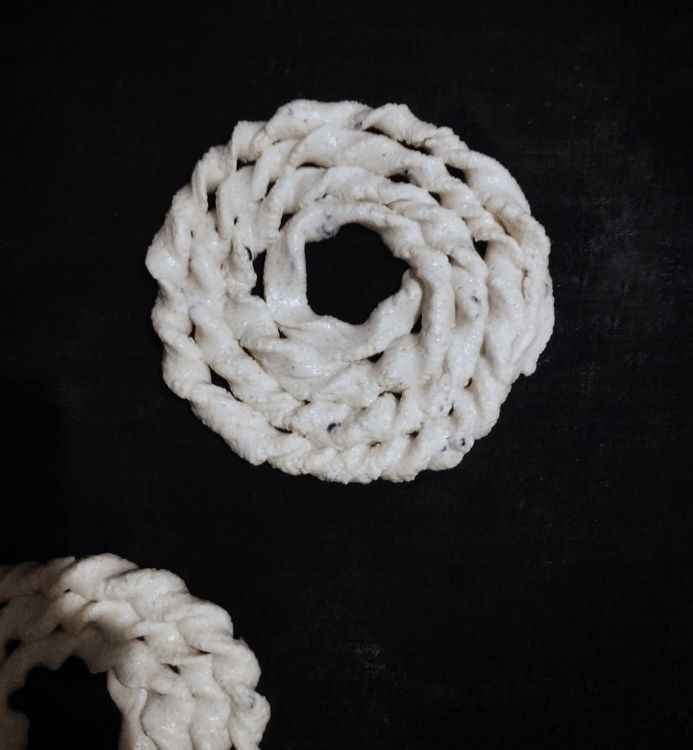 Step 1.3: Gently twist and roll the dough using your fingers to form a spiral or coil shape on a cotton cloth