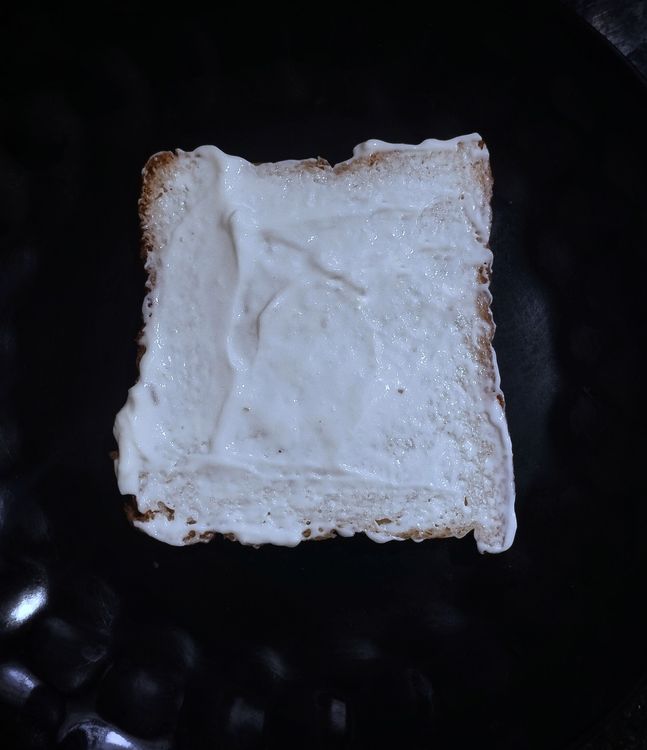 Step 1.1: Take one slice of bread and spread cream cheese evenly on one side