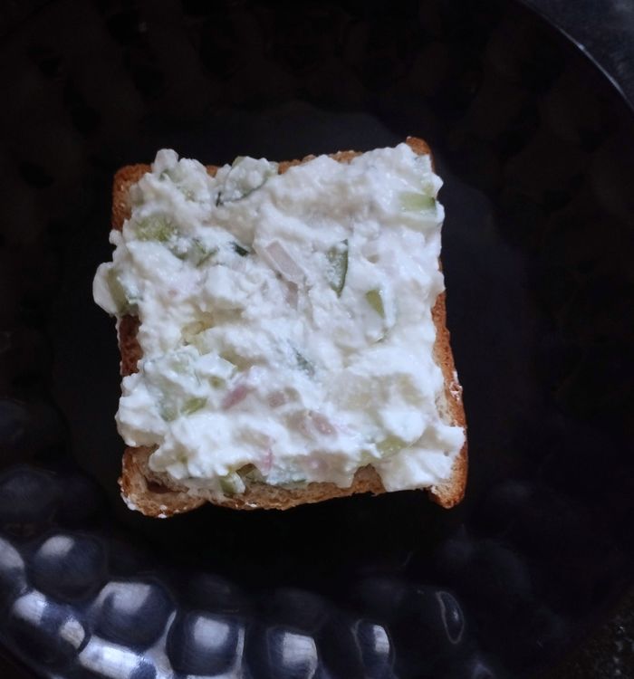 Step 1.1: Take one bread slice and evenly spread the curd mixture on it
