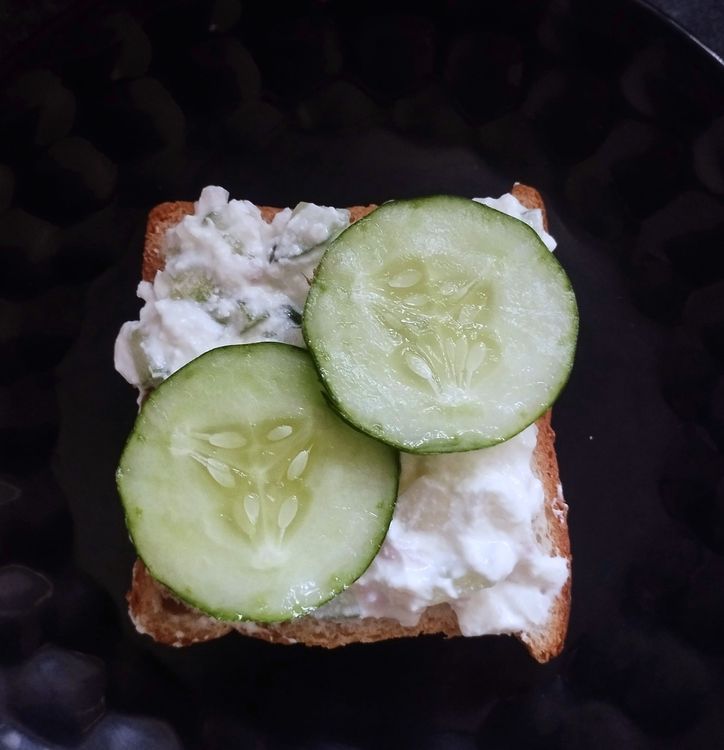Step 1.1: Place two cucumber slices over the curd mixture