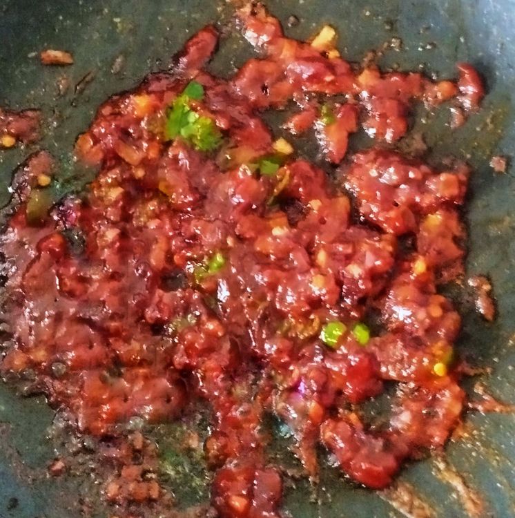 Step 2.1: Turn the flame to low and add vinegar, chilli paste, soya sauce, and tomato ketchup