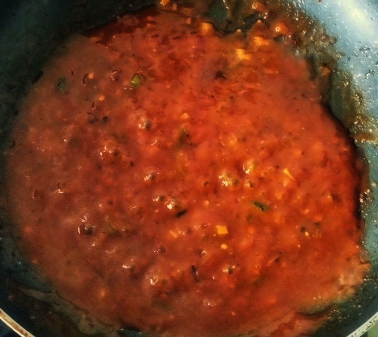 Step 2.1: Add the corn flour slurry to the sauce mix and stir continuously on medium flame until the sauce slightly thickens