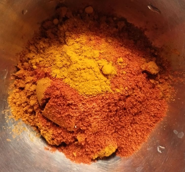 Step 1.1: Mix chilli powder, turmeric powder, and coriander powder with 2-3 tbsp of water in a small bowl