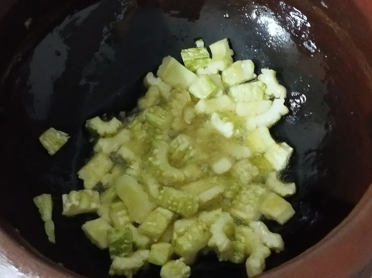 Step 2.1: Heat a khadai and add oil