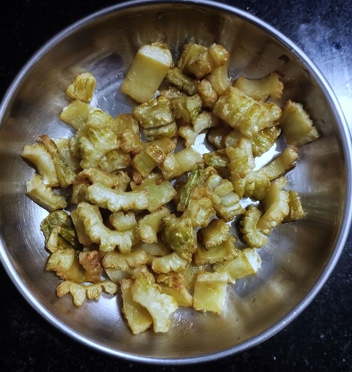 Step 2.2: Heat a khadai and add oil