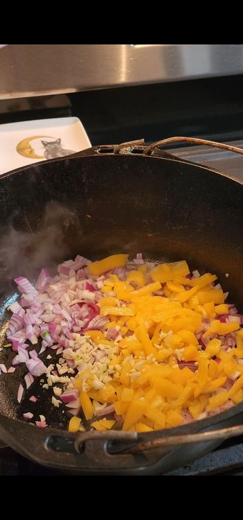 Step 1.1: Heat a large pot over medium heat and add the diced onion, bell pepper, and minced garlic