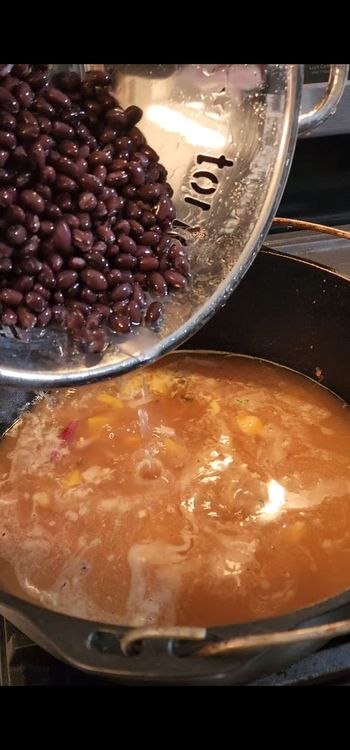 Step 1.2: Pour in the chicken bone broth, diced tomatoes with green chiles and black beans