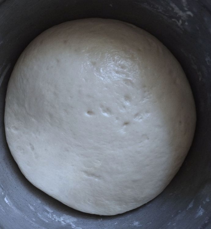 Step 1.1: Grease the dough with butter and let it sit for 1 1/2 hours or until it doubles in size