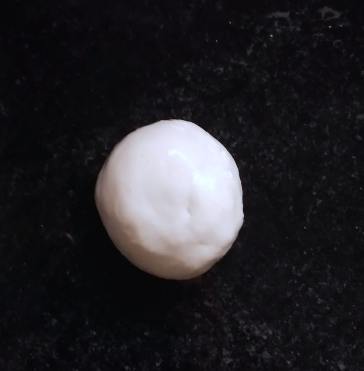 Step 1.1: After 2 hours, knead the dough again briefly and make golf ball-sized balls out of it