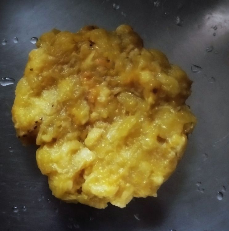Step 2.2: Peel the banana and remove the black seeds from the middle, then slightly mash it
