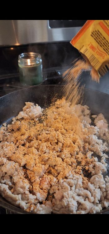Step 1.1: Stir in diced tomatoes with green chilies, aji amarillo paste, and taco seasoning
