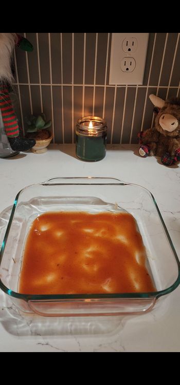 Step 1.1: Spread a thin layer of enchilada sauce (about ¼ cup) on the bottom of a baking dish