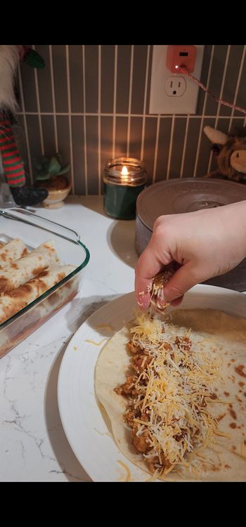 Step 1.2: Warm tortillas and fill each with chicken mixture and a small amount of cheese