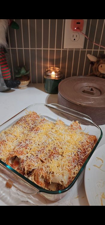 Step 1.2: Pour remaining enchilada sauce over enchiladas and top with remaining cheese