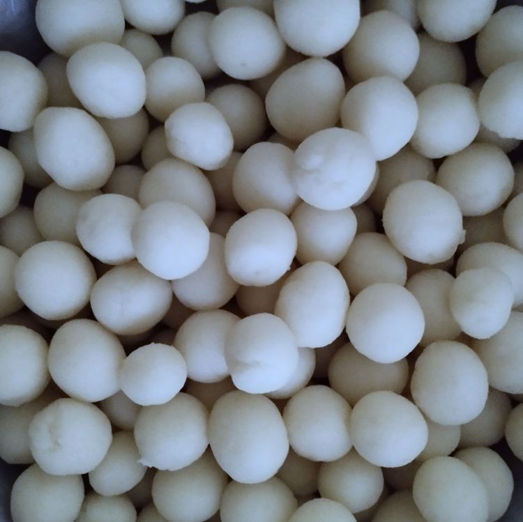Step 2.2: Pinch small portions of the dough and roll them into small marble-sized balls