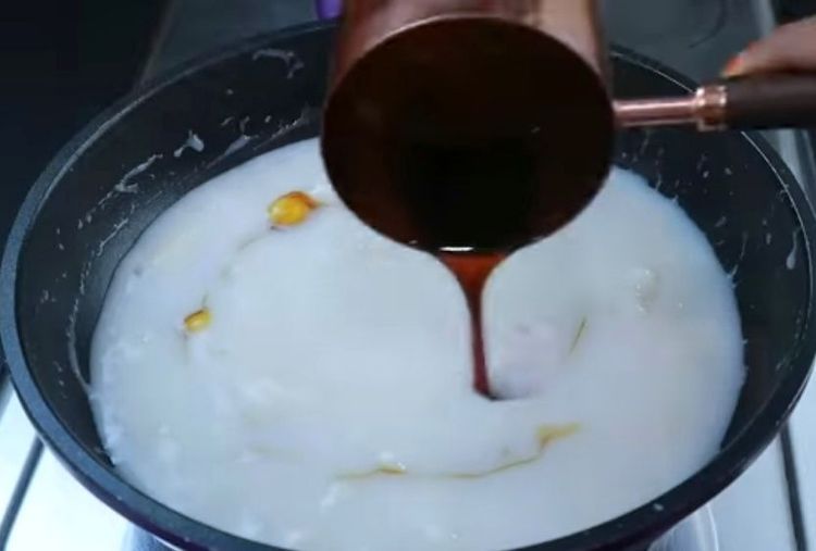 Step 5.1: Once the kozhukattai are cooked in the thin coconut milk, add the strained jaggery syrup