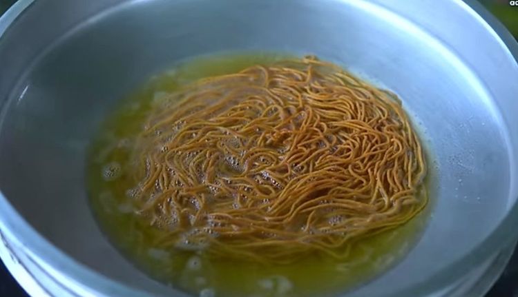 Step 1.2: Press the dough directly into hot oil and fry till crispy