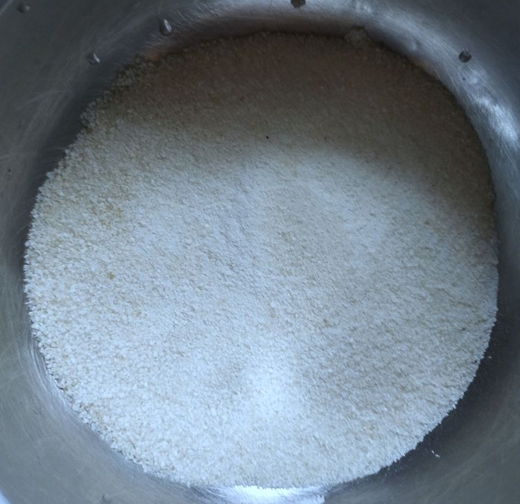 Step 1.1: To prepare the flour, in a mixing bowl, add the roasted rice flour, sugar, and a pinch of salt