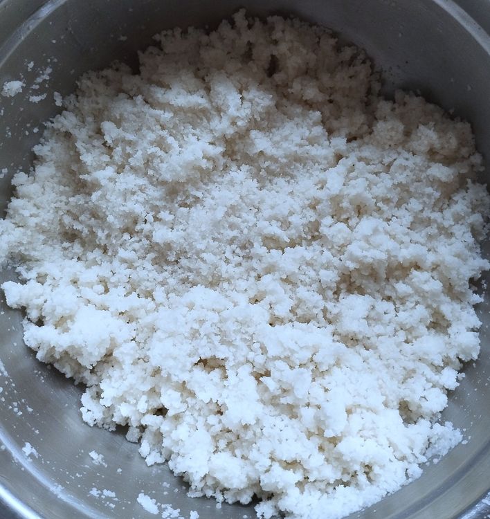 Step 1.1: Sprinkle luke warm water gradually and mix with your fingers until the flour becomes crumbly and slightly moist
